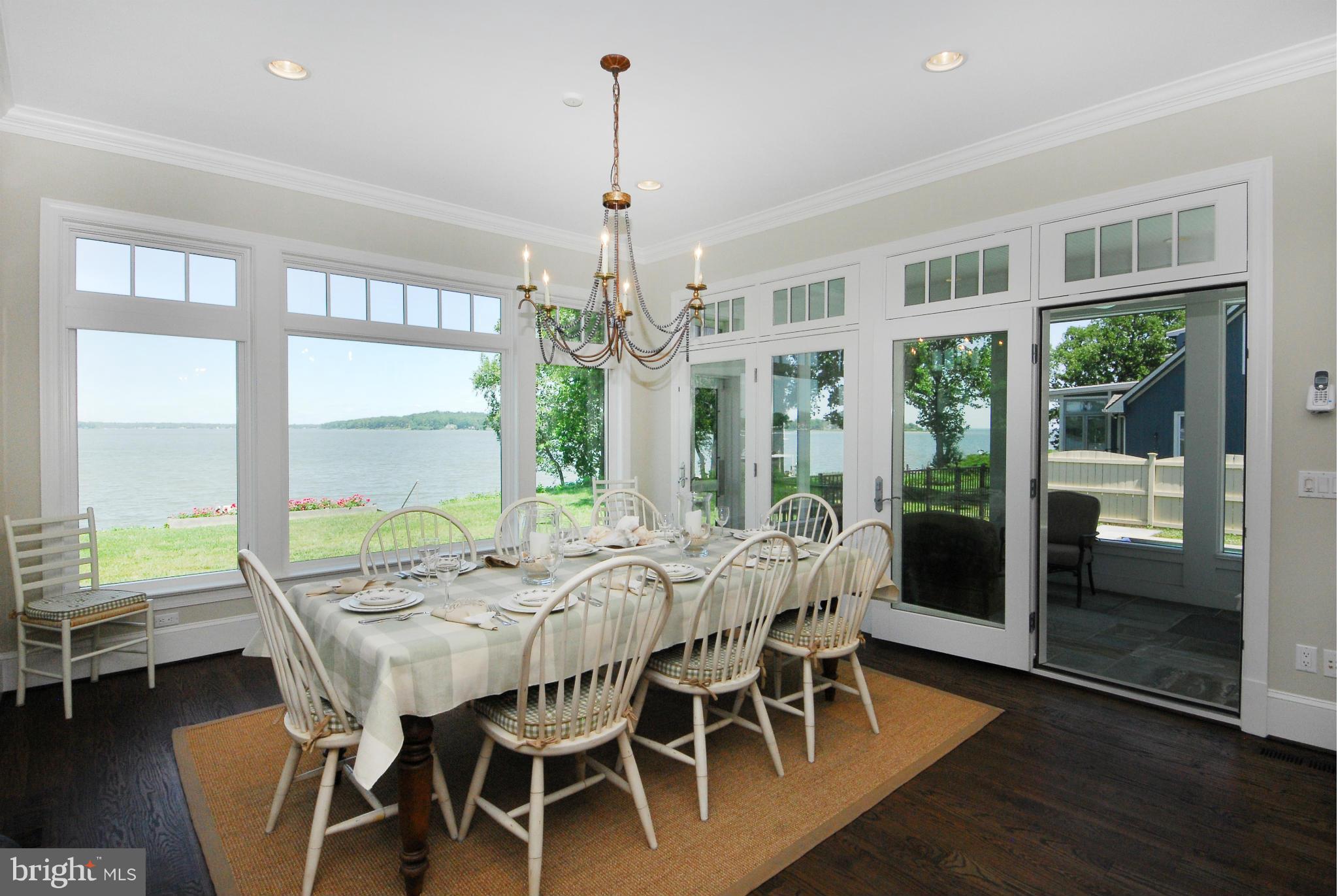 Dining room has wrap-around waterviews
