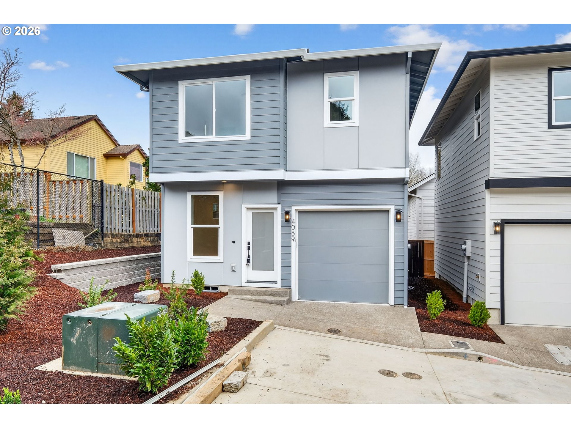 4059 Southwest McKinley Street, Unit 40 Gresham, OR 97080 - Photo 35 of 39 a front view of a house with garden