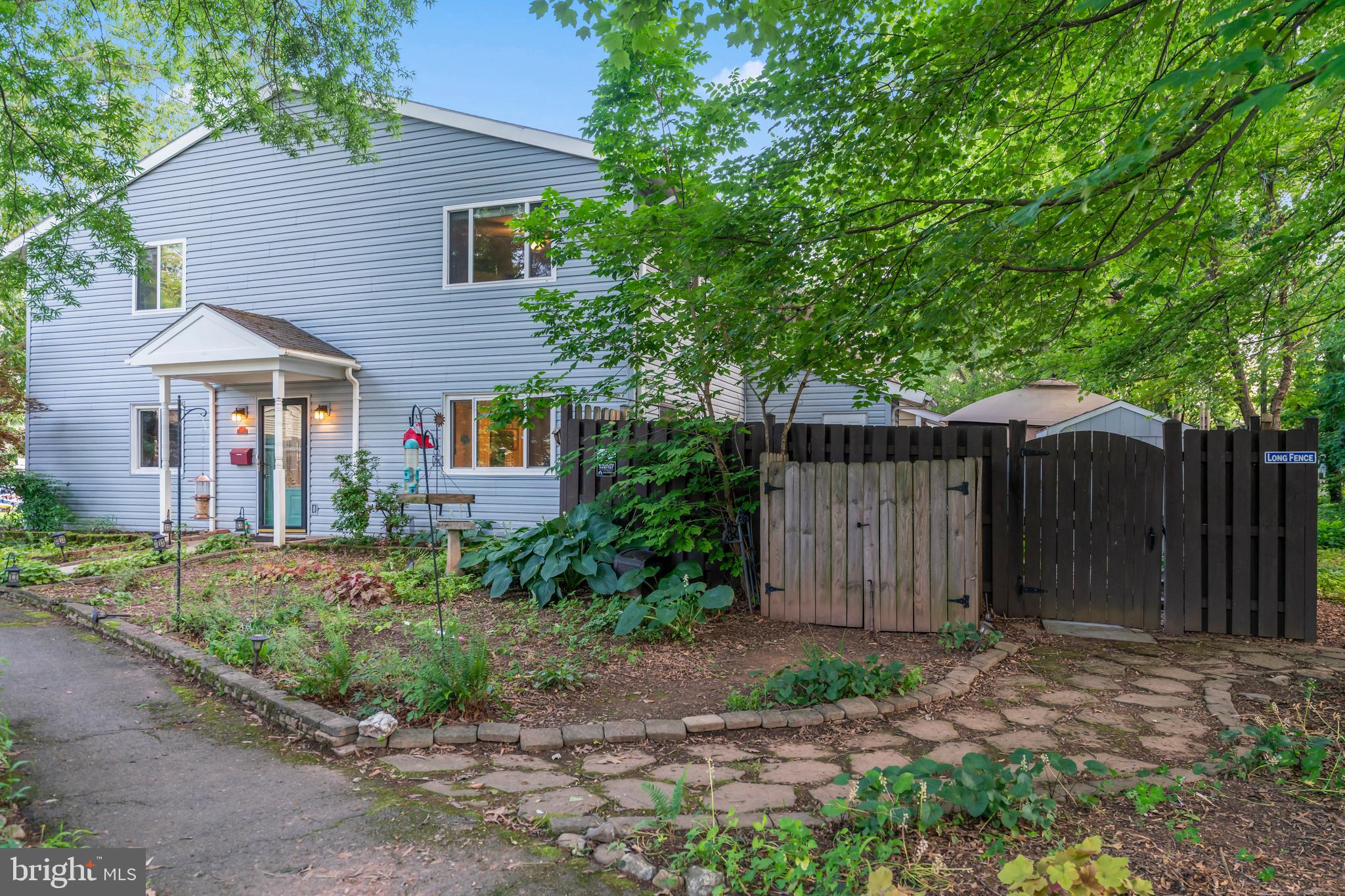 101 Hayloft Circle Sterling, VA 20164 - Photo 1 of 39 a front view of a house with garden