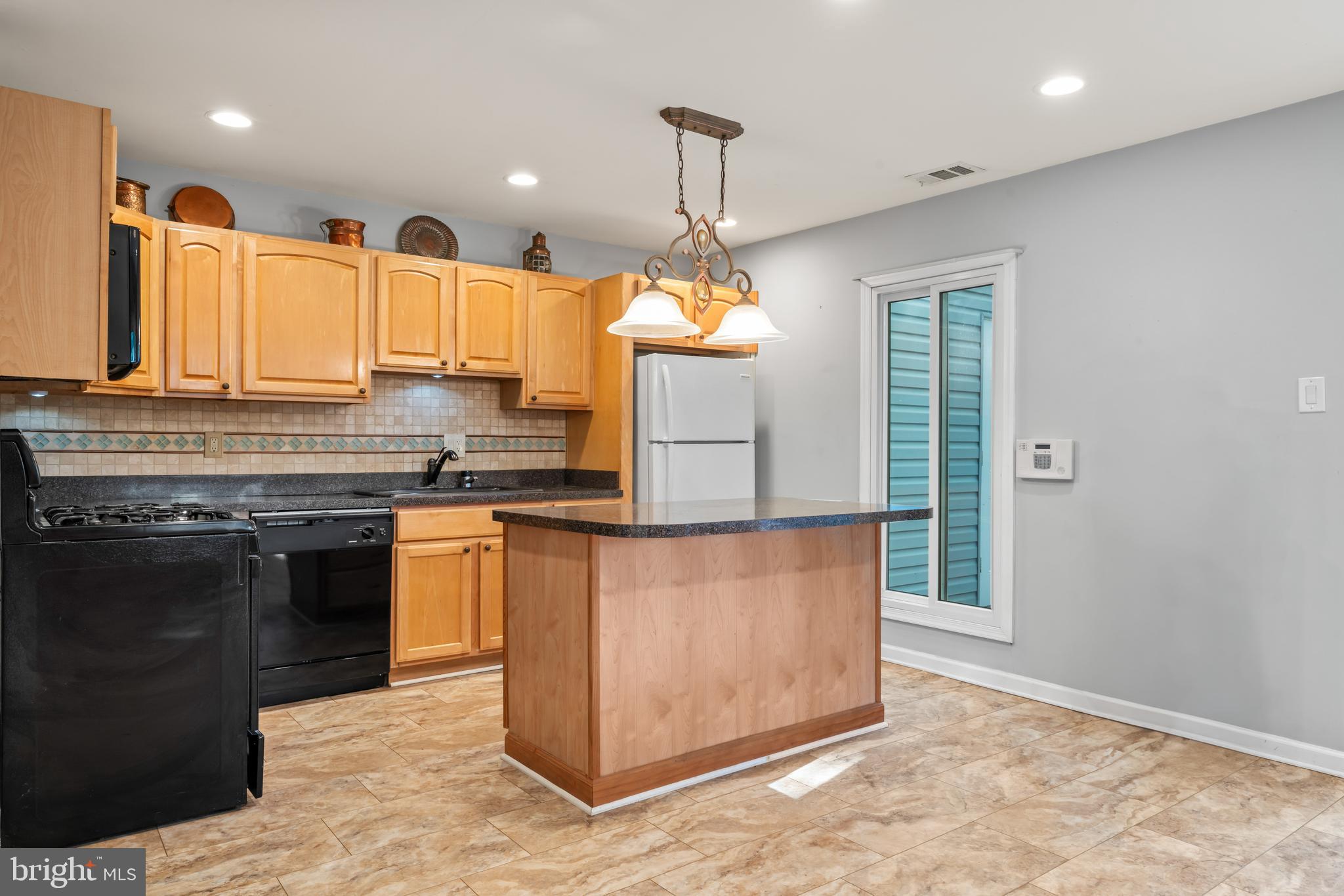 101 Hayloft Circle Sterling, VA 20164 - Photo 12 of 39 a kitchen with stainless steel appliances granite countertop a stove a sink and a refrigerator