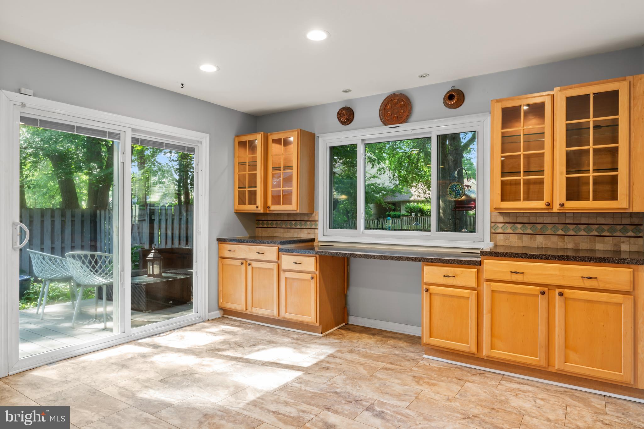 101 Hayloft Circle Sterling, VA 20164 - Photo 15 of 39 a open kitchen with granite countertop a stove top oven sink and cabinets
