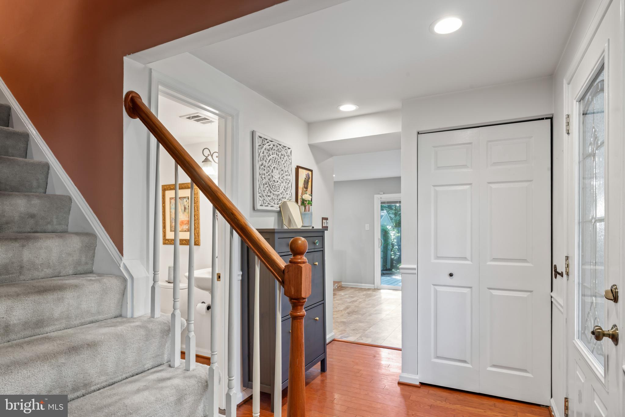 101 Hayloft Circle Sterling, VA 20164 - Photo 18 of 39 a view of an entryway with wooden floor and staircase