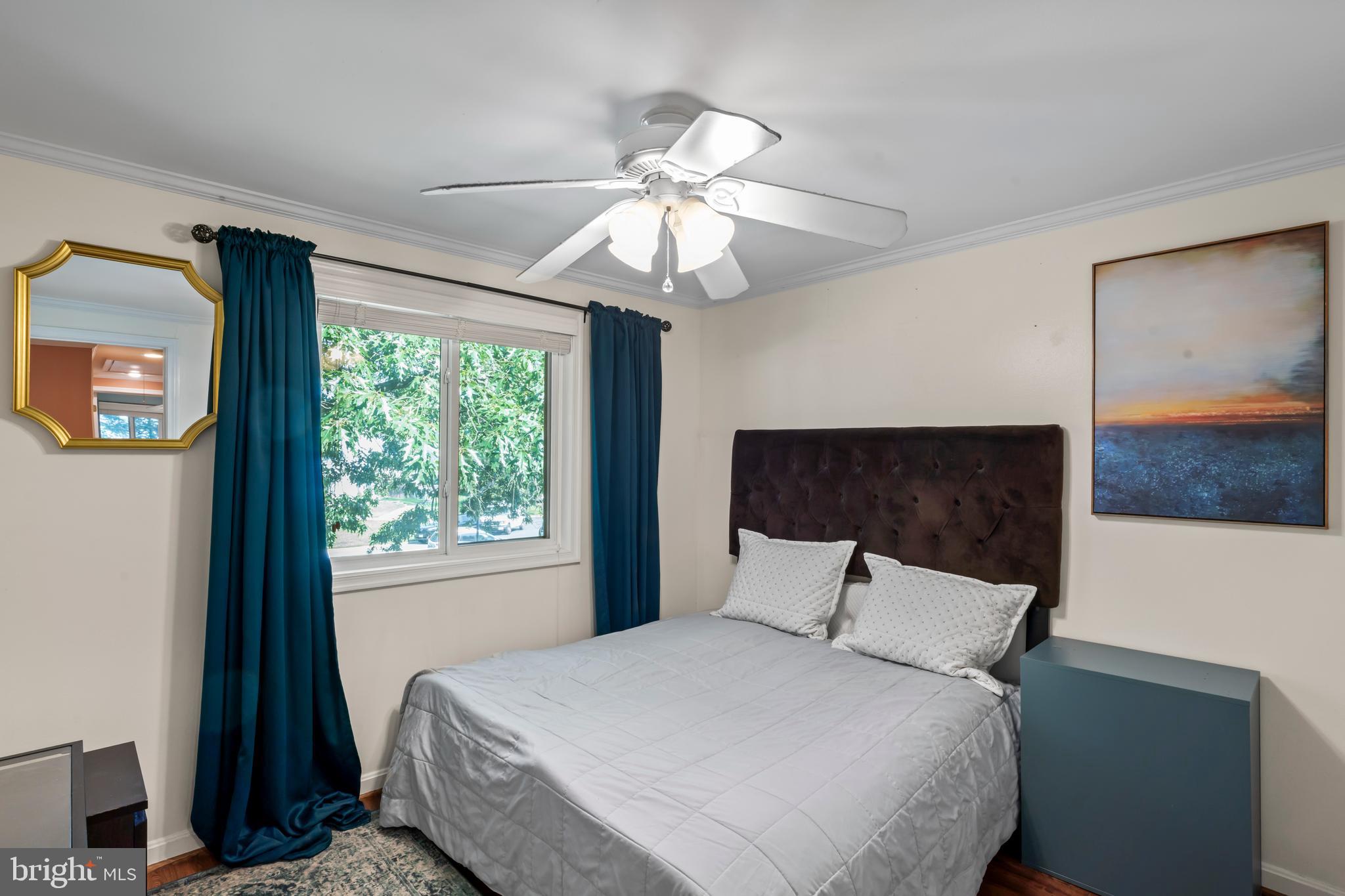101 Hayloft Circle Sterling, VA 20164 - Photo 23 of 39 a bedroom with a bed and a chandelier