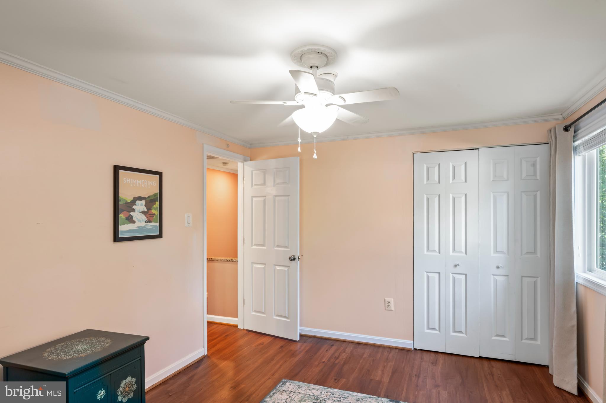 101 Hayloft Circle Sterling, VA 20164 - Photo 26 of 39 an empty room with wooden floor chandelier fan and windows