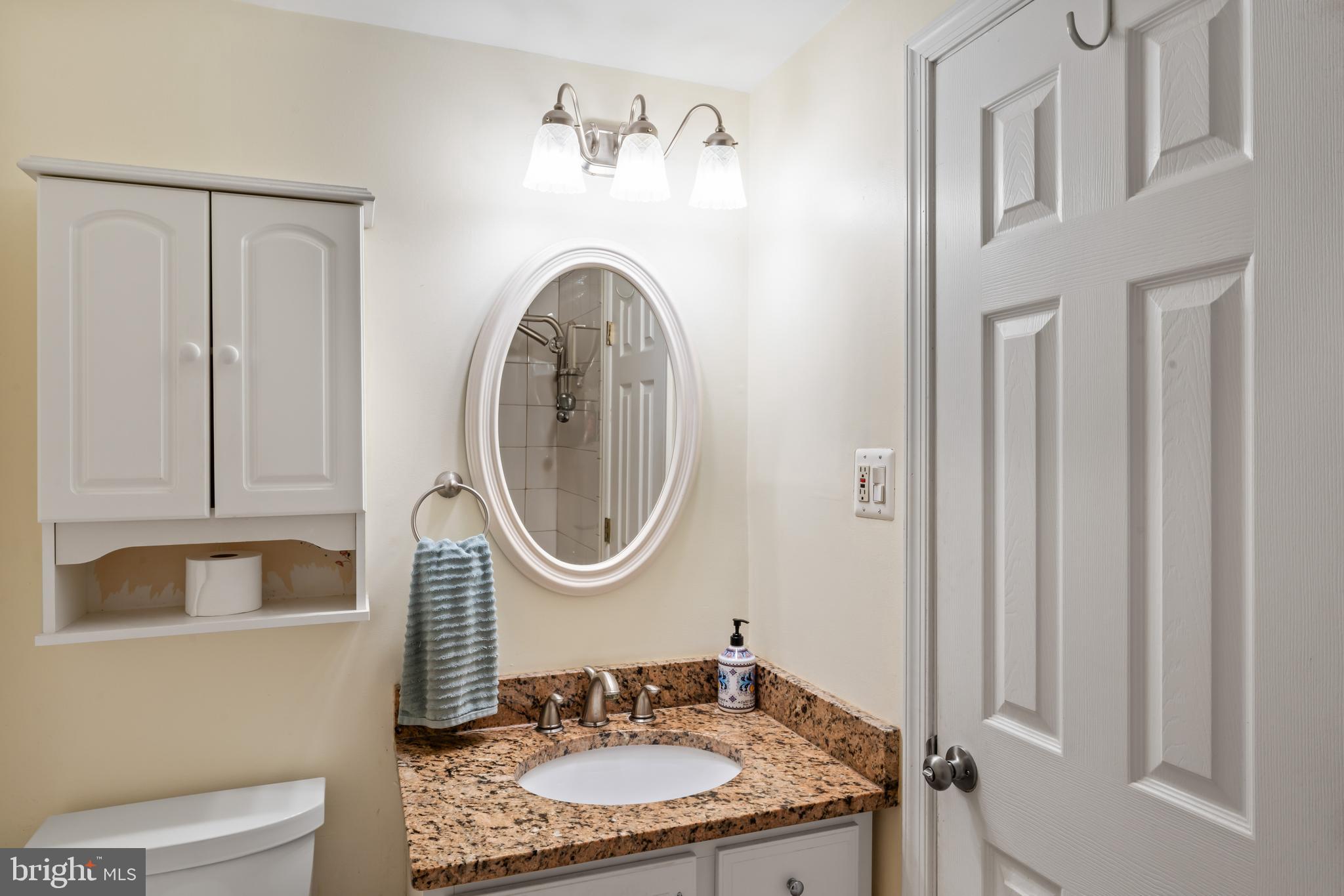 101 Hayloft Circle Sterling, VA 20164 - Photo 30 of 39 a bathroom with a granite countertop sink and a mirror