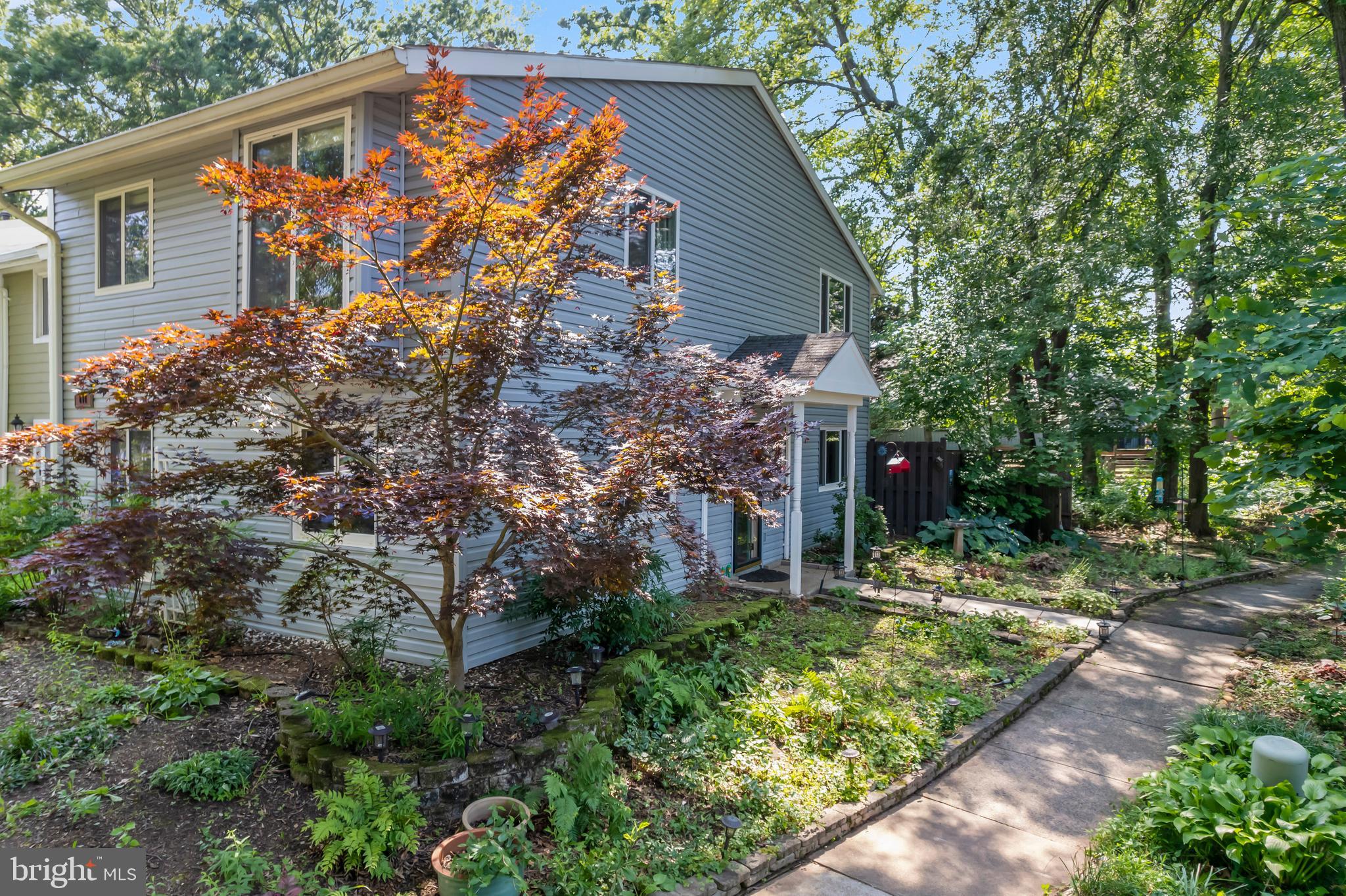 101 Hayloft Circle Sterling, VA 20164 - Photo 3 of 39 a backyard of a house with lots of green space