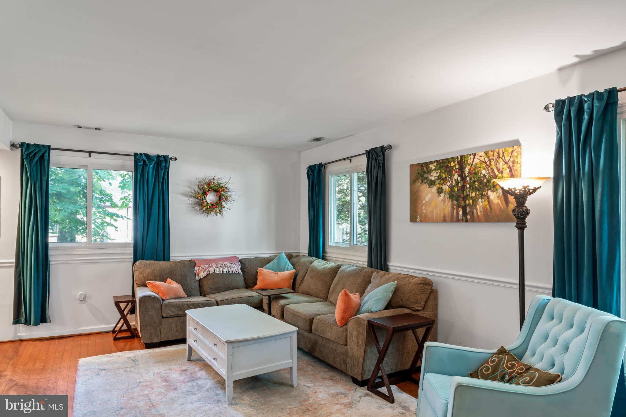 101 Hayloft Circle Sterling, VA 20164 - Photo 8 of 39 a living room with furniture and a window