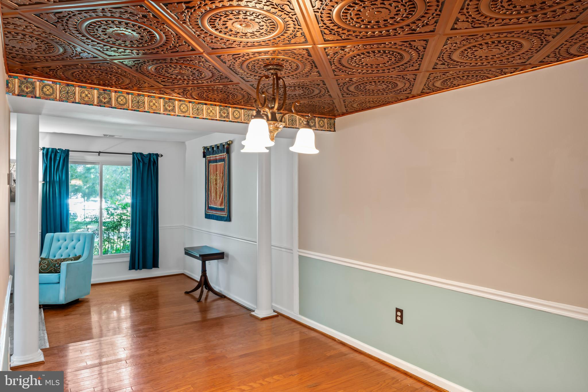 101 Hayloft Circle Sterling, VA 20164 - Photo 10 of 39 a view of a room with wooden floor and potted plants