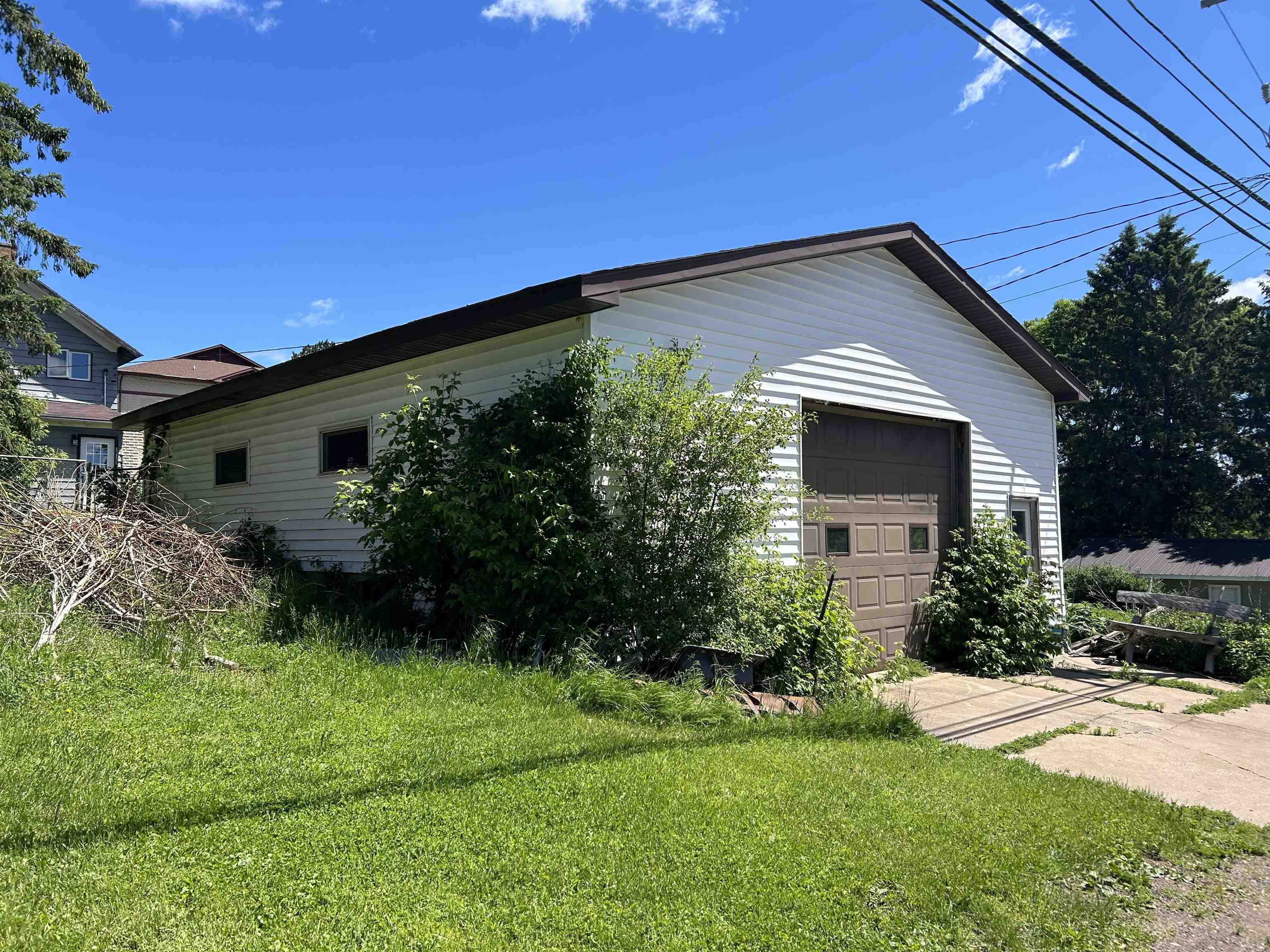 157 East 2nd Street Glidden, WI 54527 - Photo 15 of 15 Exterior space with a garage and a front yard