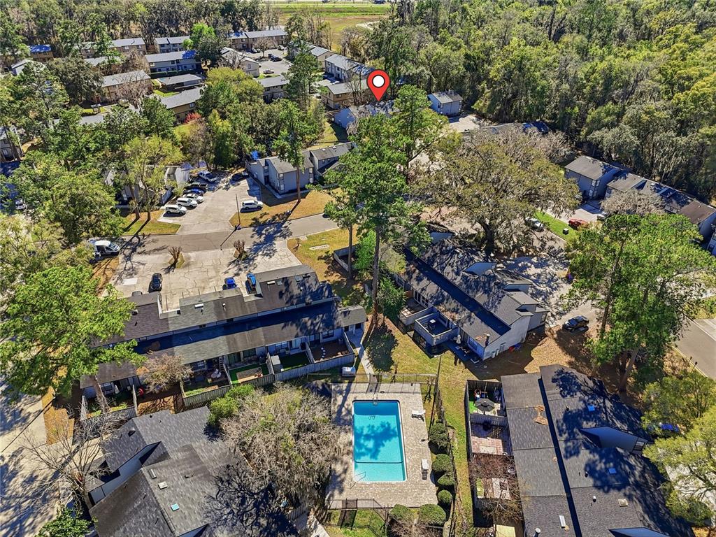 4427 Southwest 21st Lane Gainesville, FL 32607 - Photo 26 of 36 an aerial view of a house with a yard and garden
