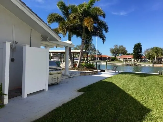 a view of a swimming pool and lounge chairs