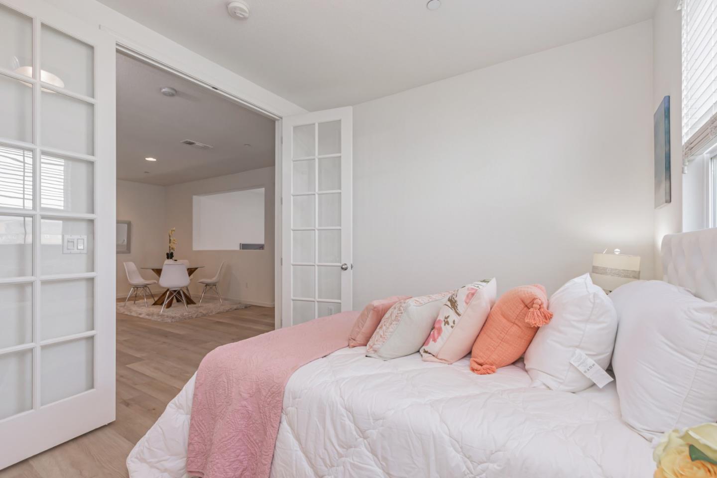 1744 Snell Place Milpitas, CA 95035 - Photo 15 of 35 a bedroom with a bed and a lamp