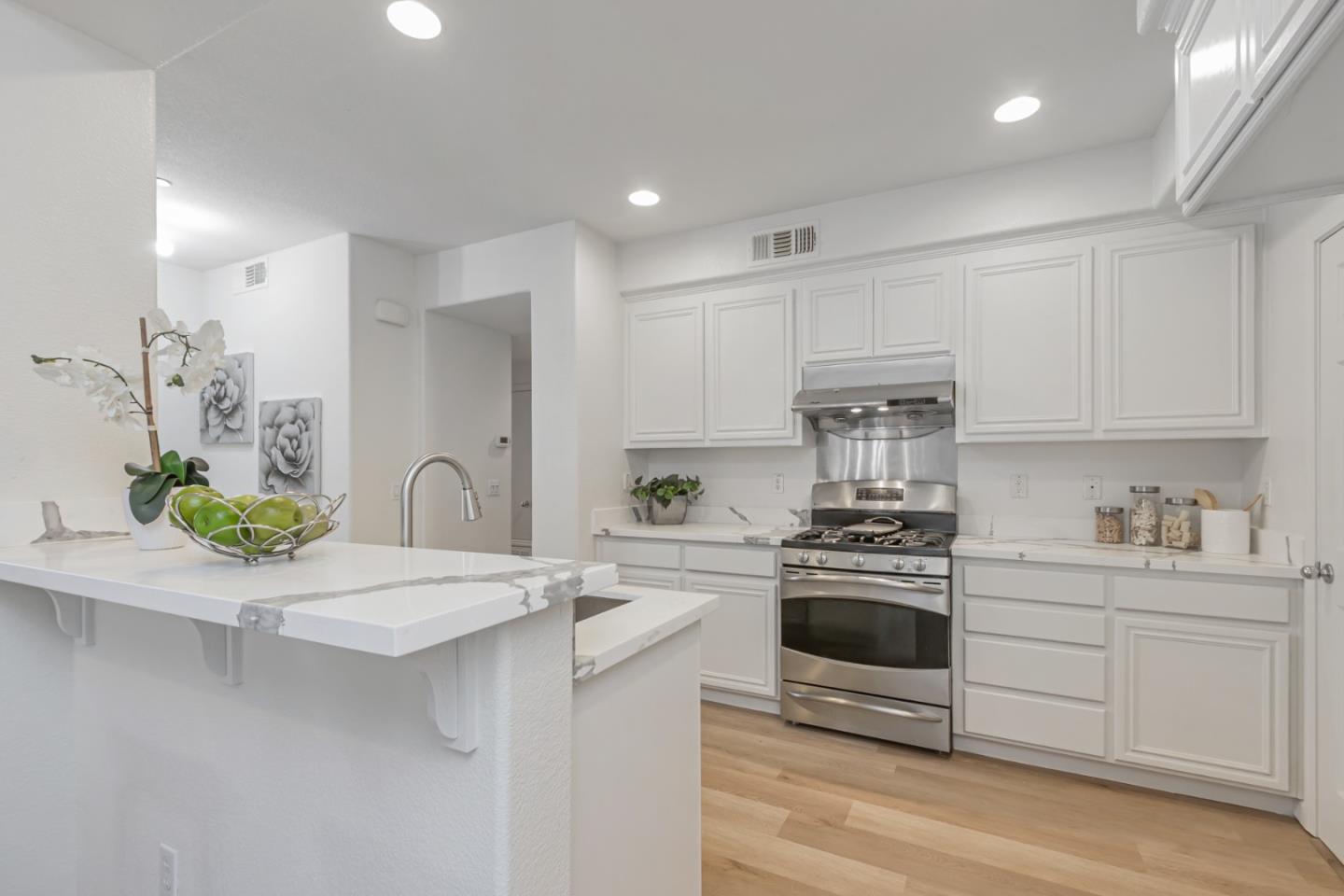1744 Snell Place Milpitas, CA 95035 - Photo 2 of 35 a kitchen with a sink stove and cabinets