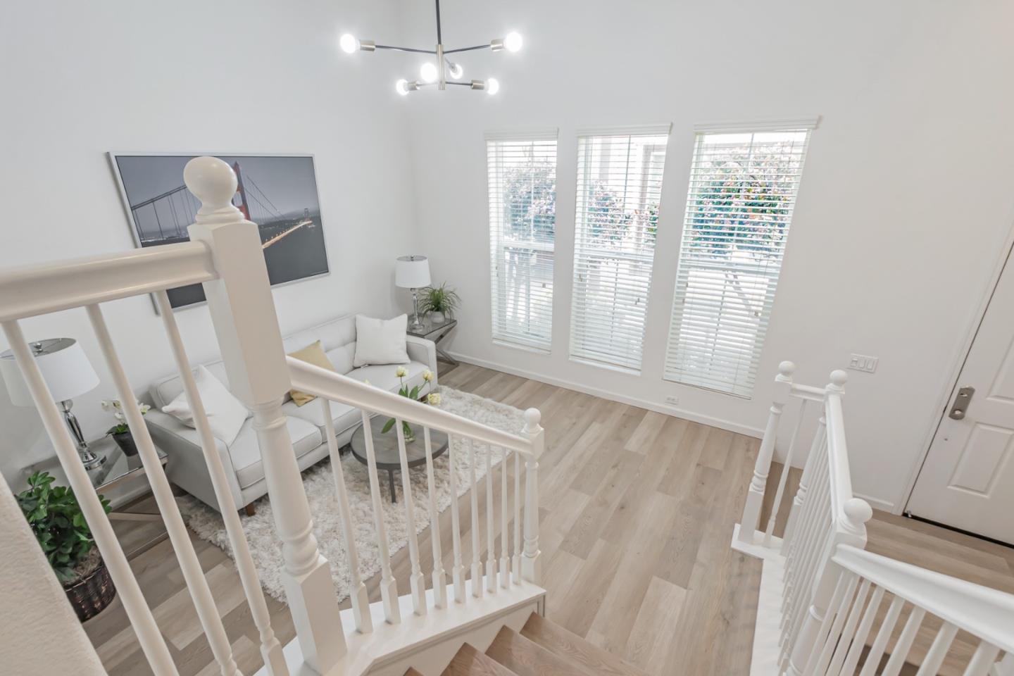 1744 Snell Place Milpitas, CA 95035 - Photo 7 of 35 a view of an empty room with wooden floor and windows