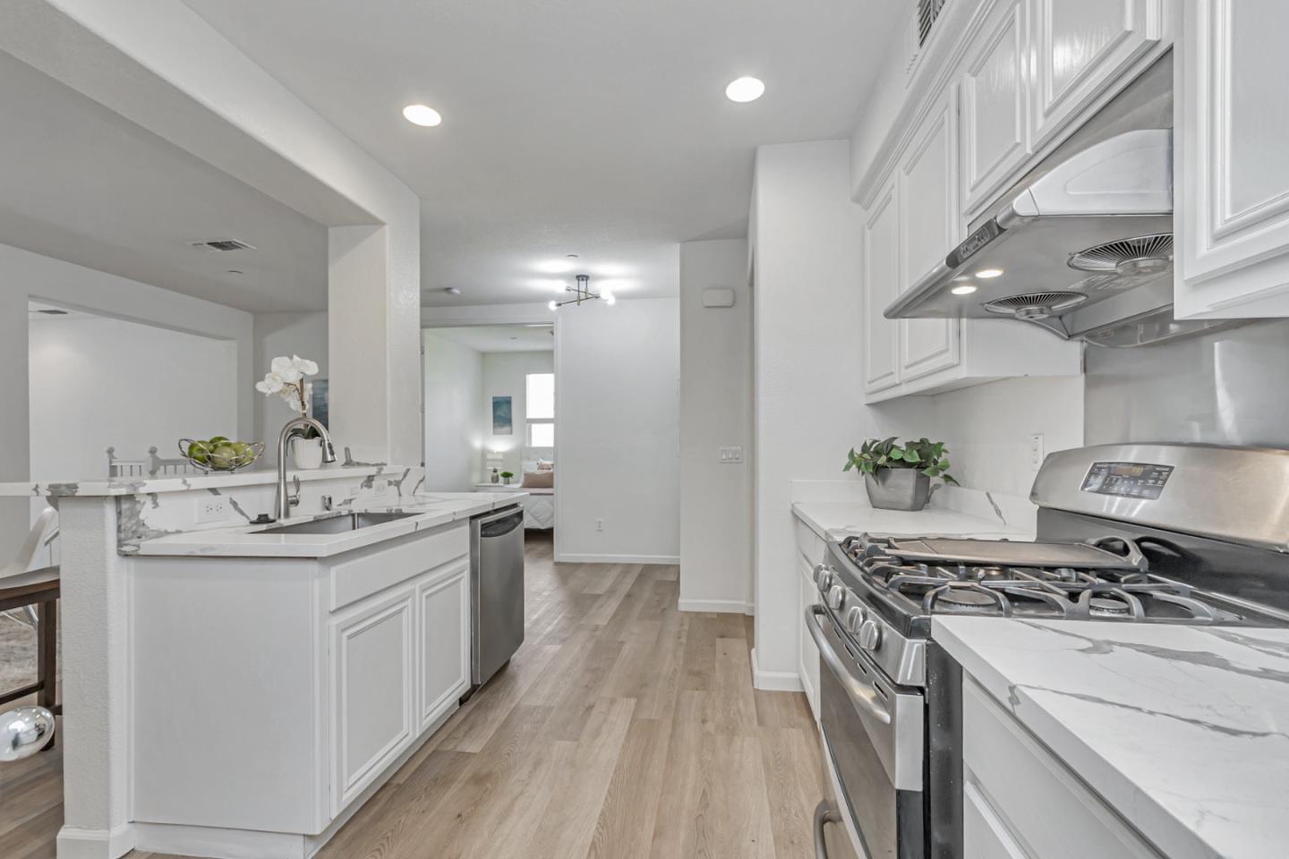 1744 Snell Place Milpitas, CA 95035 - Photo 8 of 35 a kitchen with a sink stove and cabinets