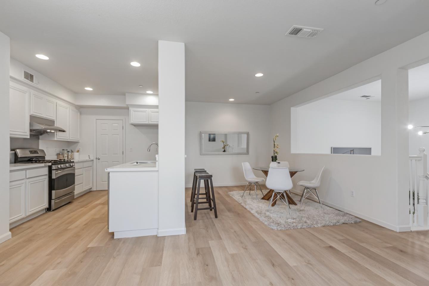 1744 Snell Place Milpitas, CA 95035 - Photo 10 of 35 a living room with stainless steel appliances furniture wooden floor and a kitchen view