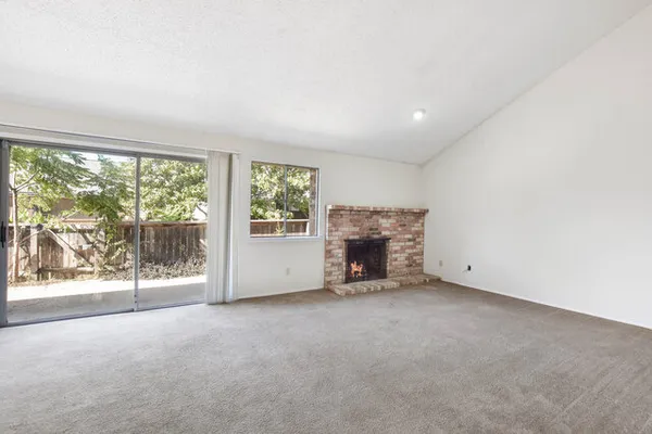 an empty room with fireplace