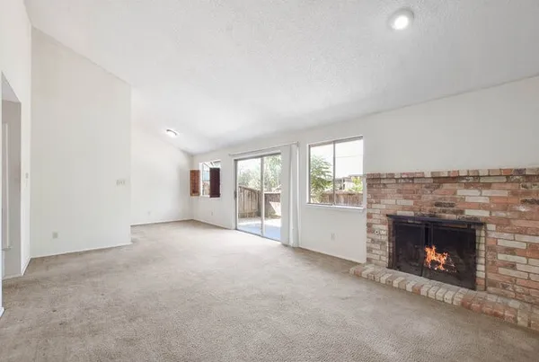 an empty room with fireplace
