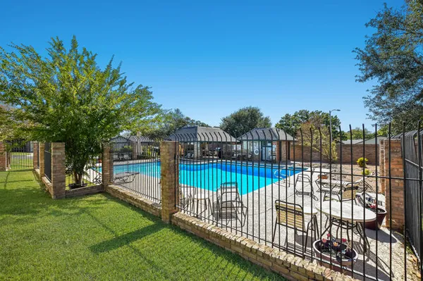 a view of a wrought iron fences in front of house