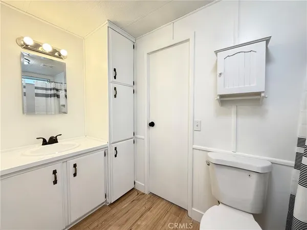 a bathroom with a shower curtain and a sink