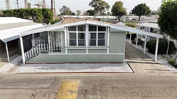 a view of front of house with a yard