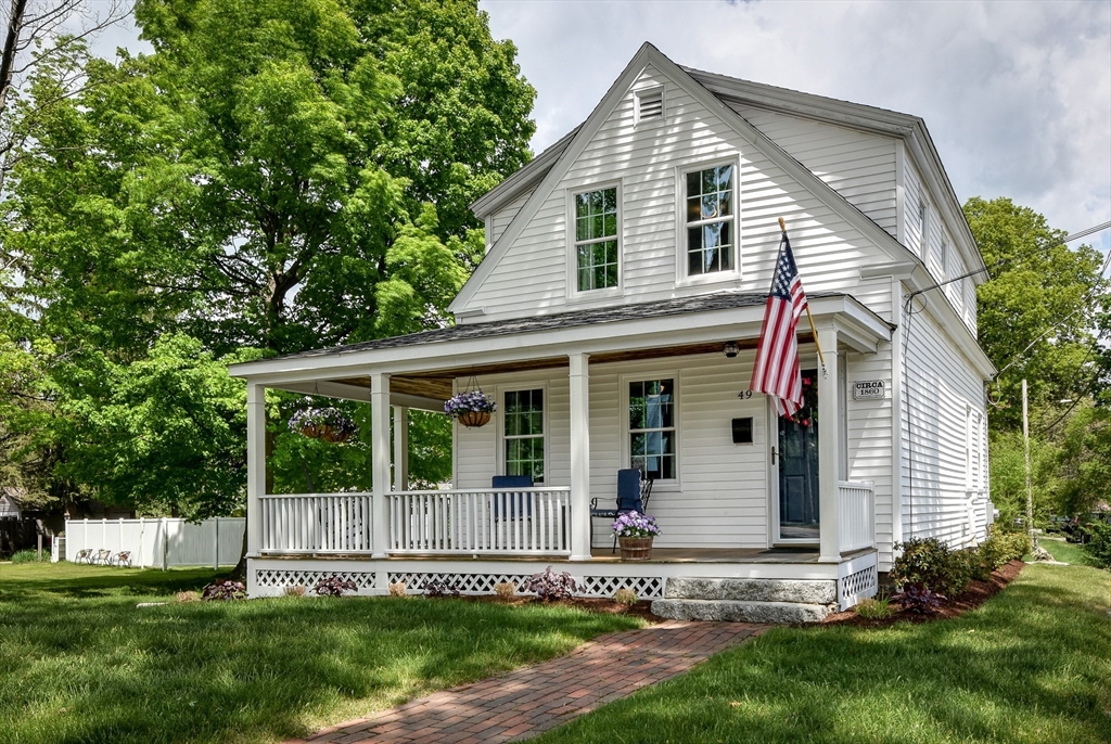 49 Hayden Rowe Street Hopkinton, MA 01748 - Photo 1 of 39 a view of a house with a yard and sitting area
