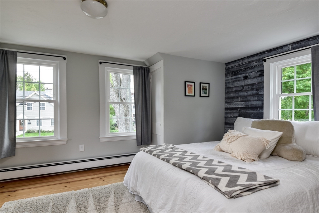 49 Hayden Rowe Street Hopkinton, MA 01748 - Photo 22 of 39 a bedroom with a bed and a window