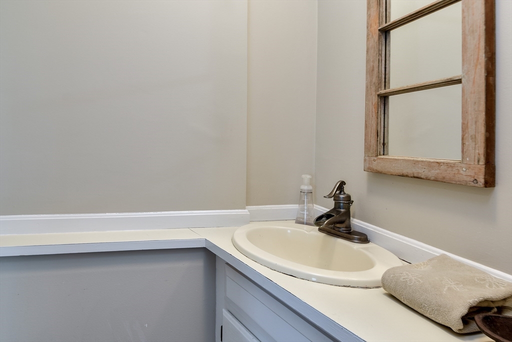 49 Hayden Rowe Street Hopkinton, MA 01748 - Photo 25 of 39 a bathroom with a sink and a mirror