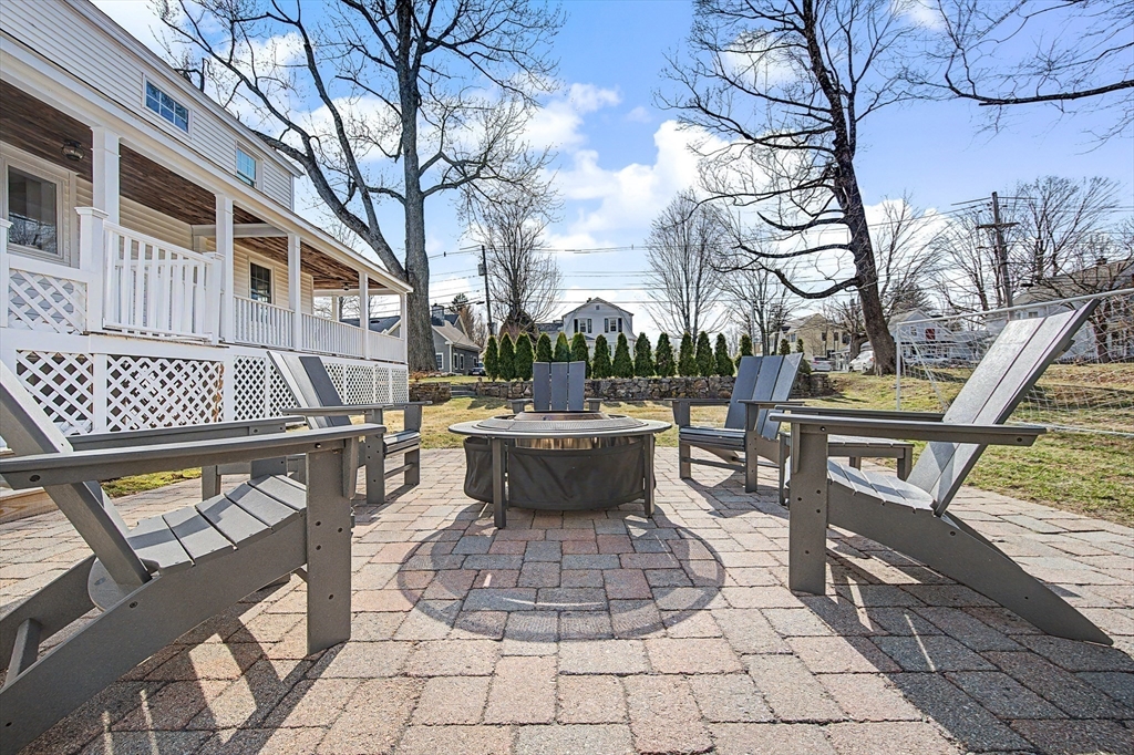 49 Hayden Rowe Street Hopkinton, MA 01748 - Photo 28 of 39 a view of a patio with couches fire pit and furniture