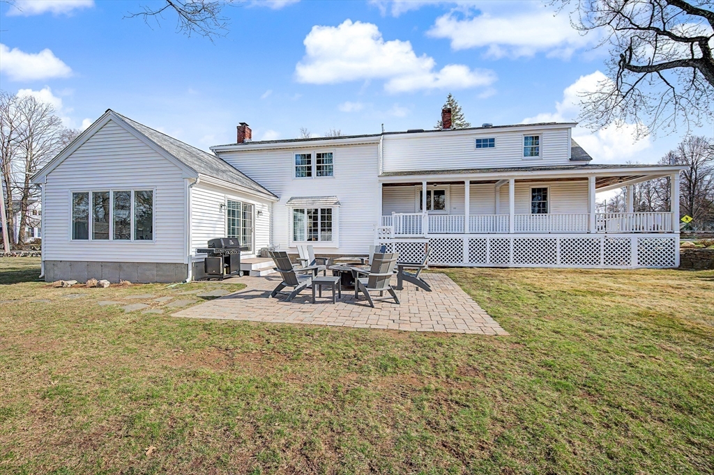 49 Hayden Rowe Street Hopkinton, MA 01748 - Photo 29 of 39 a view of a house with dining space and swimming pool