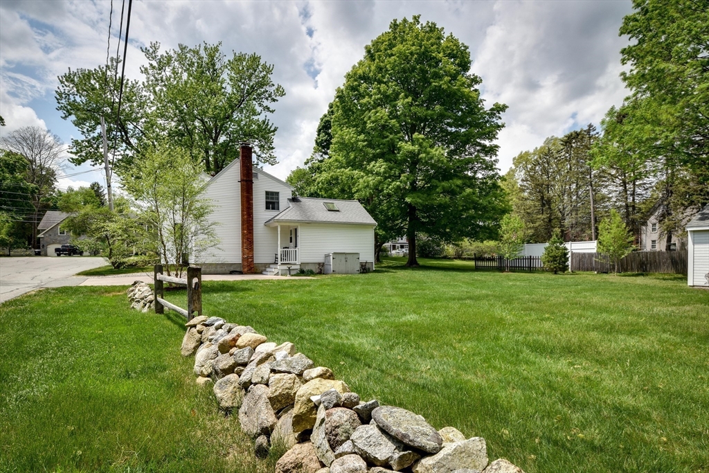 49 Hayden Rowe Street Hopkinton, MA 01748 - Photo 33 of 39 a front view of a house with garden