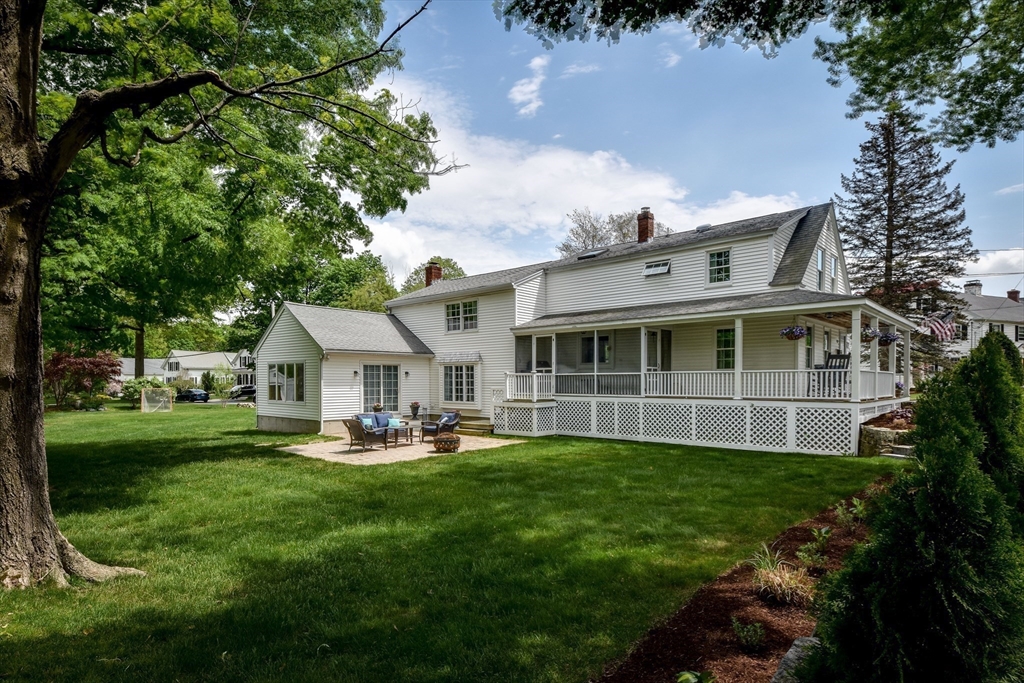 49 Hayden Rowe Street Hopkinton, MA 01748 - Photo 36 of 39 a front view of a house with a yard and trees