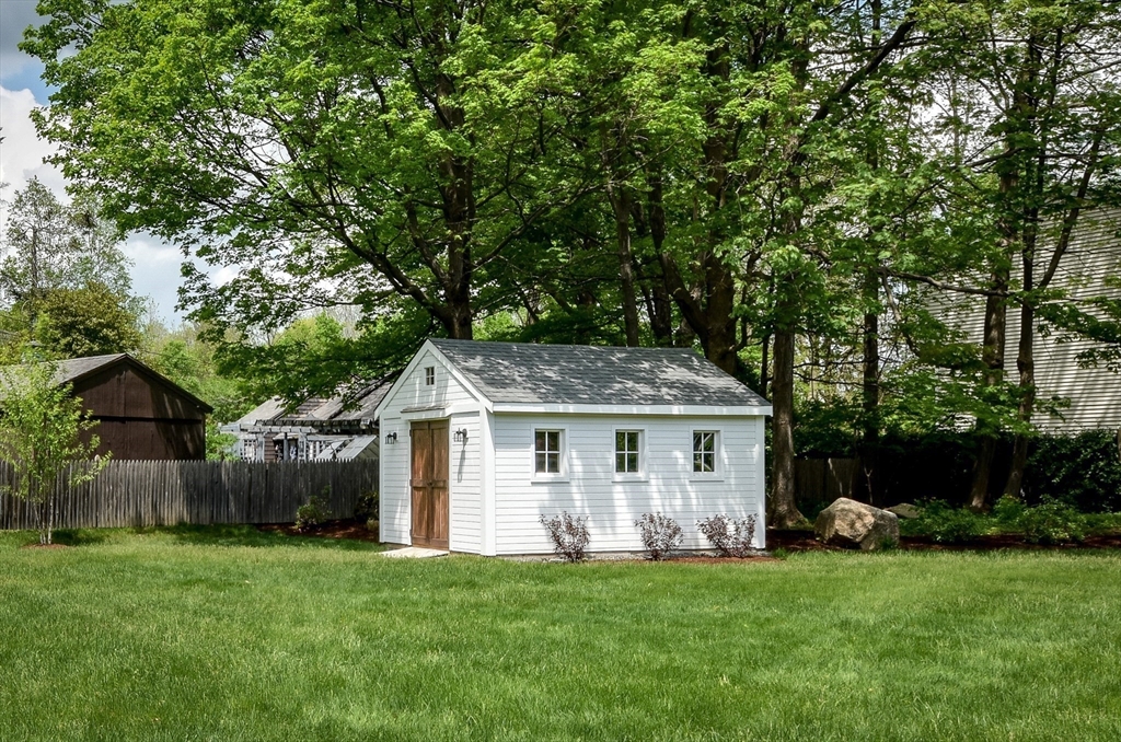 49 Hayden Rowe Street Hopkinton, MA 01748 - Photo 37 of 39 a front view of a house with a garden