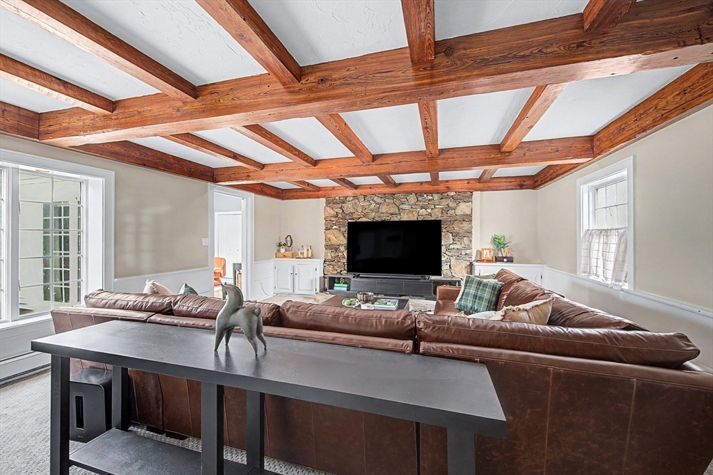 49 Hayden Rowe Street Hopkinton, MA 01748 - Photo 6 of 39 a living room with furniture and a flat screen tv