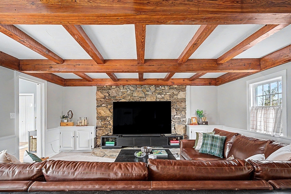 49 Hayden Rowe Street Hopkinton, MA 01748 - Photo 7 of 39 a living room with furniture and a fireplace