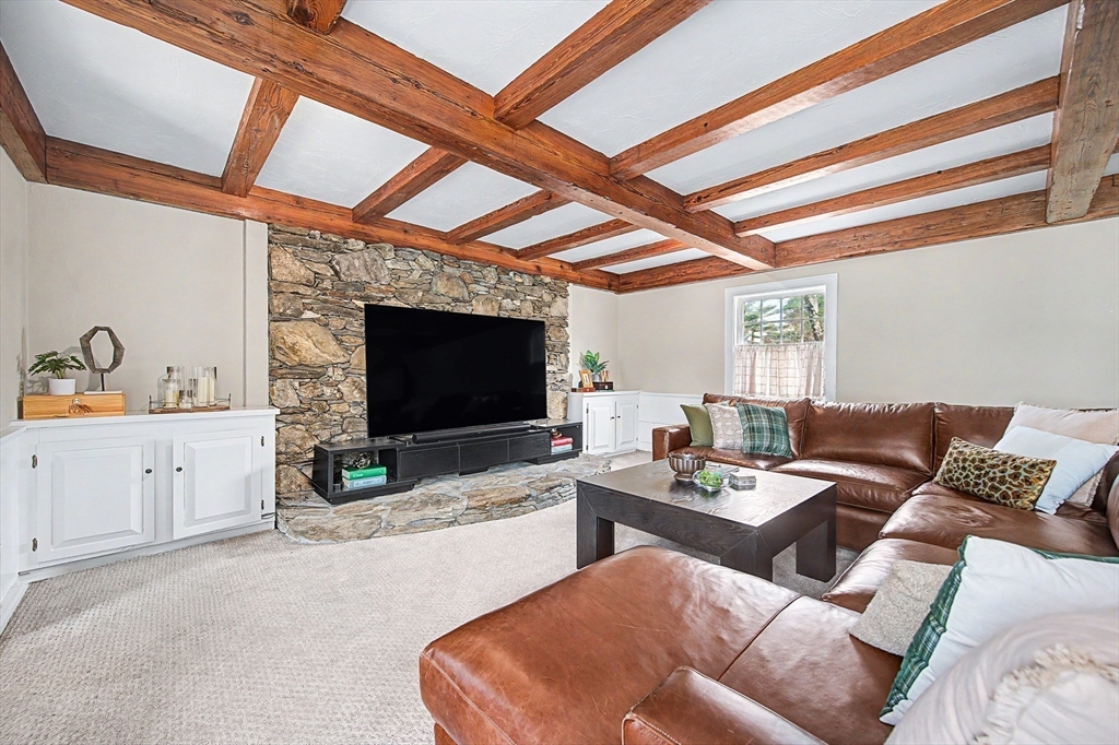 49 Hayden Rowe Street Hopkinton, MA 01748 - Photo 8 of 39 a living room with furniture and a flat screen tv