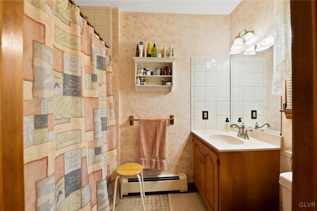 2744 Moore Circle Bath, PA 18014 - Photo 22 of 31 a bathroom with a sink a mirror and a shower