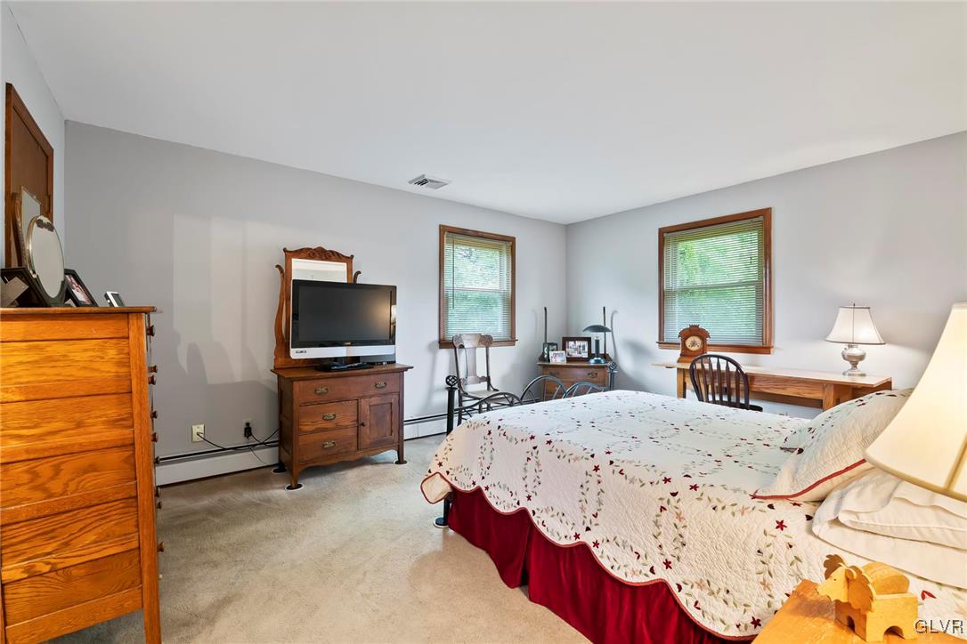 2744 Moore Circle Bath, PA 18014 - Photo 25 of 31 a living room with furniture and a flat screen tv