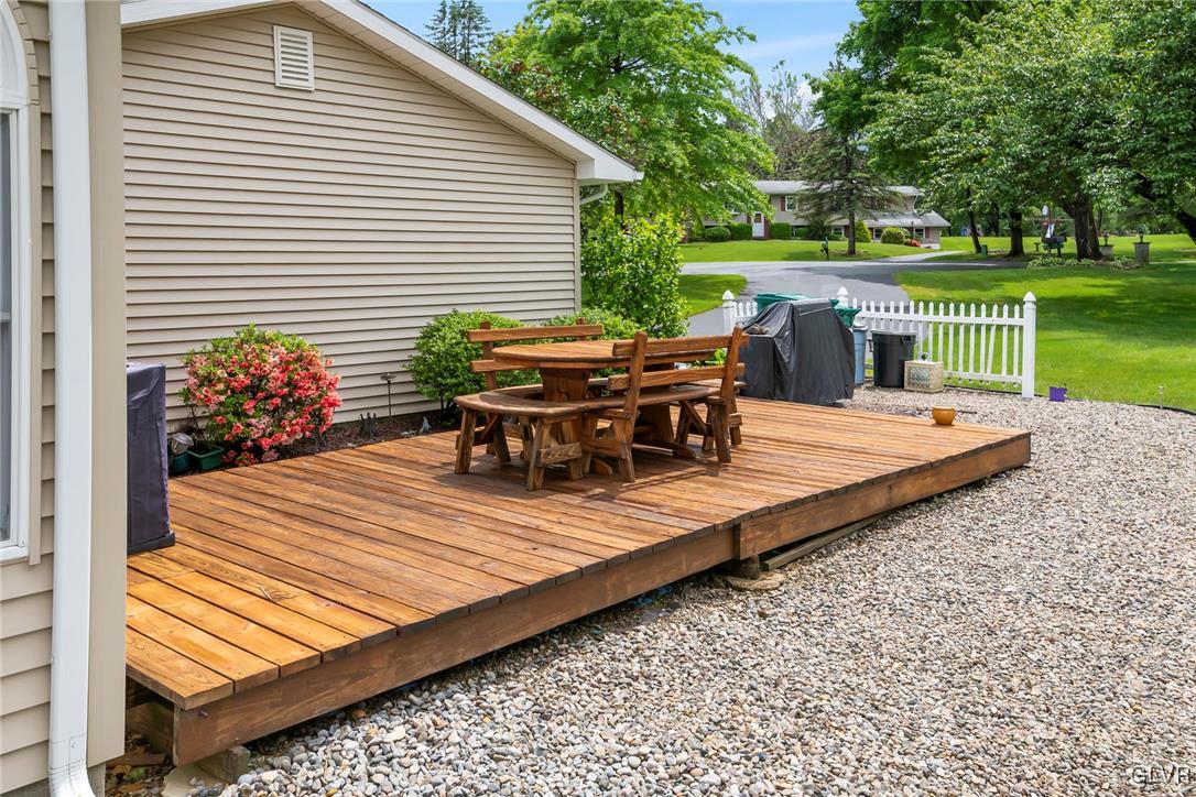 2744 Moore Circle Bath, PA 18014 - Photo 6 of 31 a view of a patio with table and chairs potted plants and a large tree
