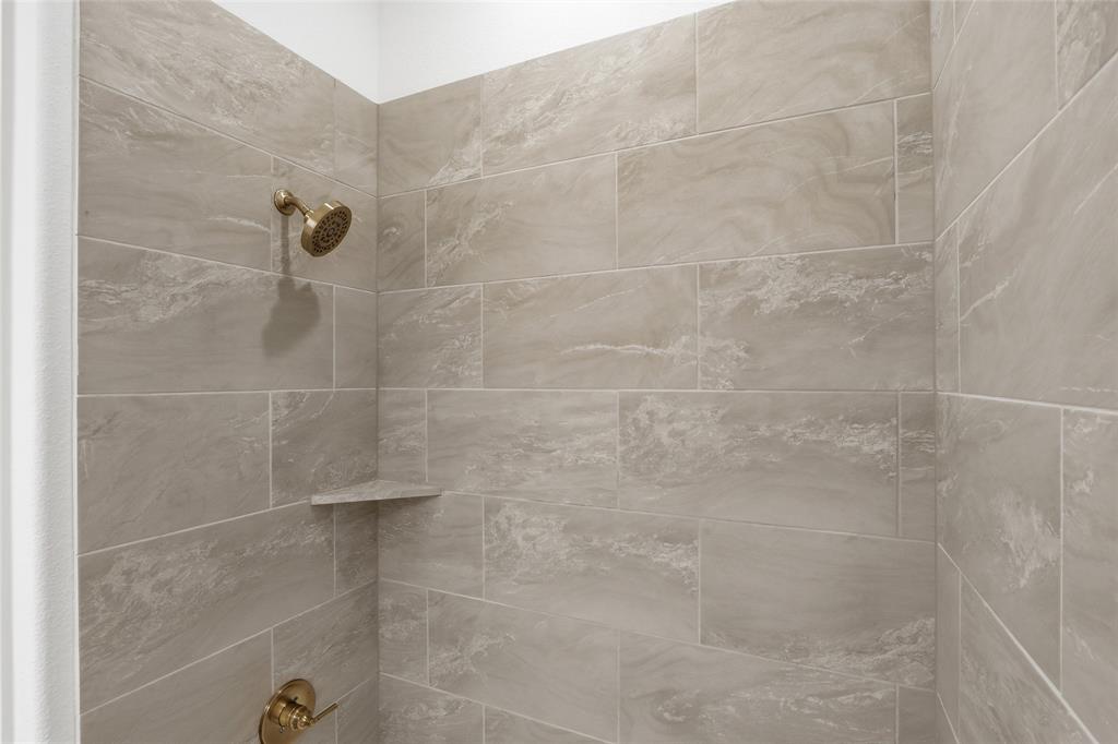 1005 Webb Court Van Alstyne, TX 75495 - Photo 27 of 38 a bathroom with a shower