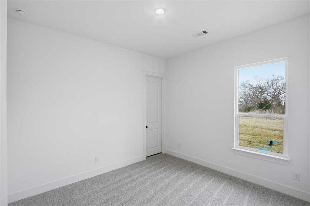 1005 Webb Court Van Alstyne, TX 75495 - Photo 28 of 38 an empty room with a window