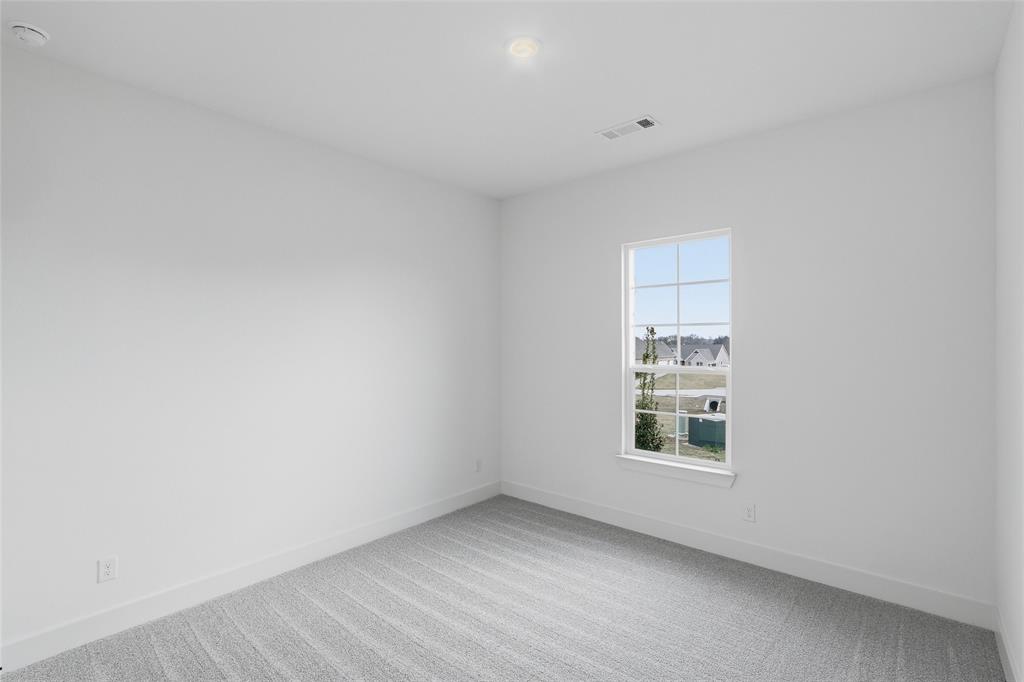 1005 Webb Court Van Alstyne, TX 75495 - Photo 29 of 38 a view of an empty room with a window