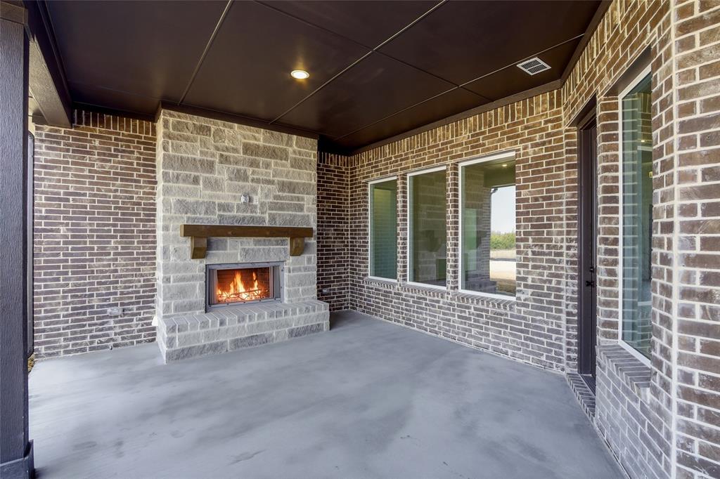 1005 Webb Court Van Alstyne, TX 75495 - Photo 31 of 38 a view of an empty room with a fireplace
