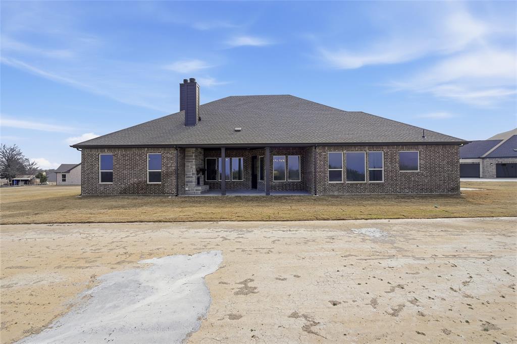 1005 Webb Court Van Alstyne, TX 75495 - Photo 33 of 38 a front view of a house with a yard