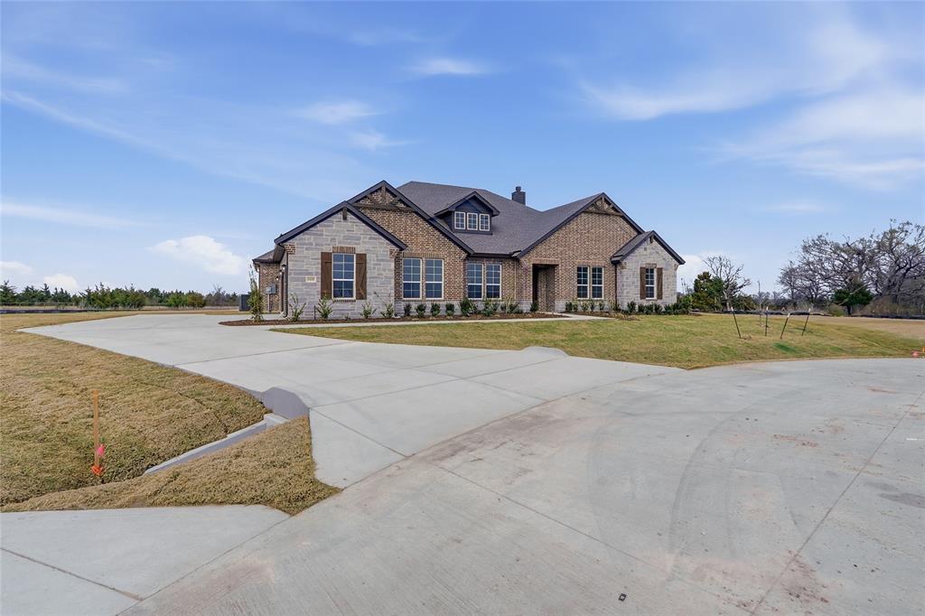 1005 Webb Court Van Alstyne, TX 75495 - Photo 4 of 38 a front view of a house with a yard and lake view