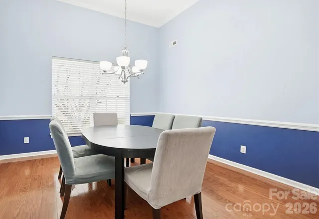 a living room with furniture and flat screen tv