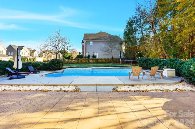 a view of a swimming pool with a lounge chairs