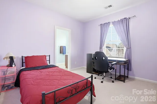 a spacious bathroom with a sink and a mirror