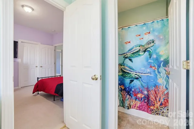 a bedroom with furniture and a window