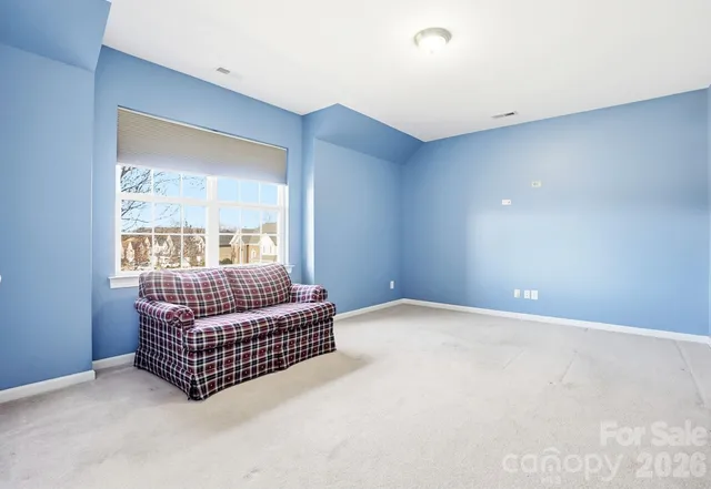 a view of a livingroom with furniture and a chair